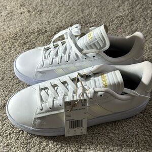 Adidas tennis shoes white and gold
